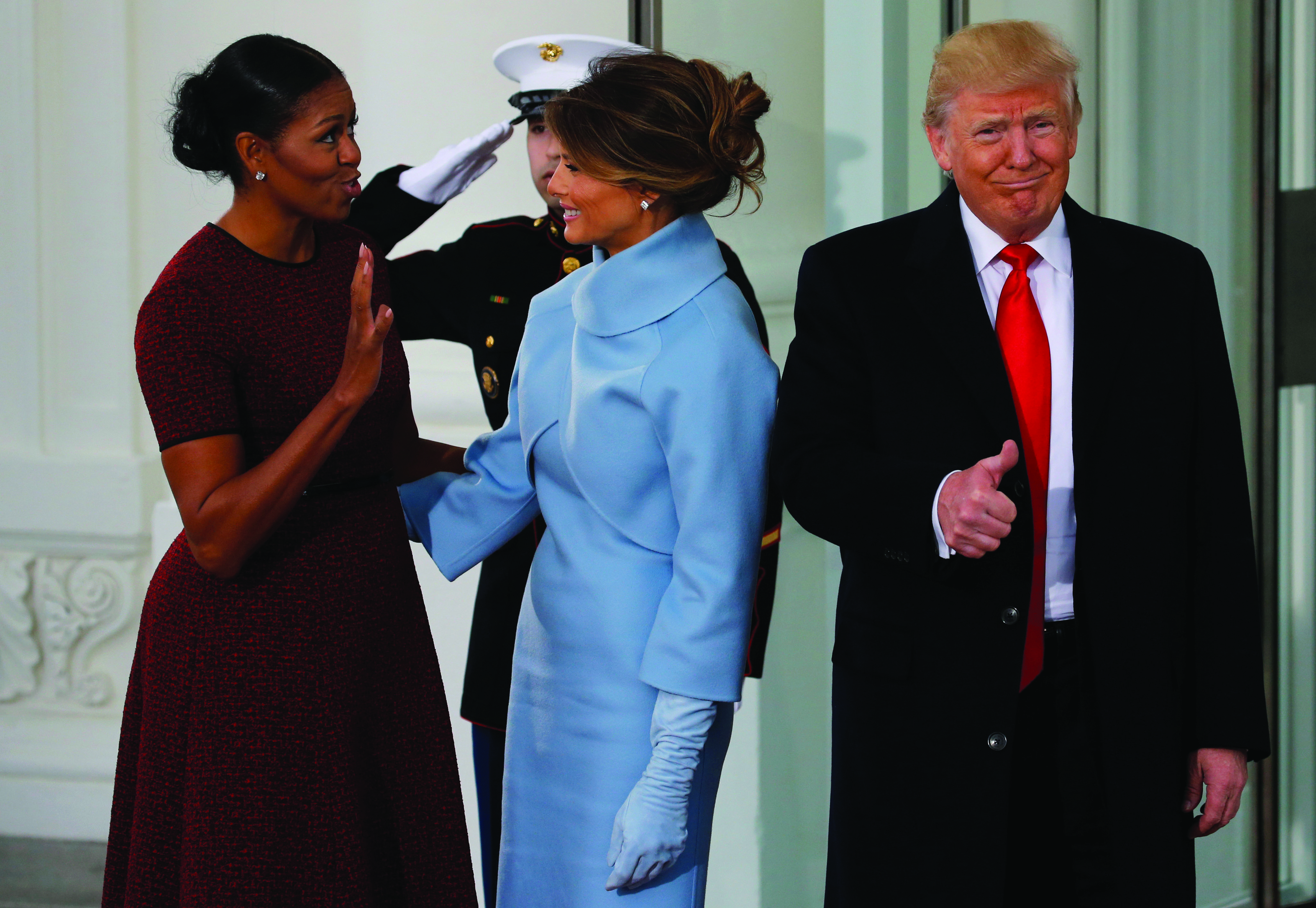 U.S. first lady Michelle Obama (L) greets U.S. President-elect Donald Trump (R) and his wife Melania for tea before the inauguration at the White House in Washington, U.S. January 20, 2017. REUTERS/Jonathan Ernst