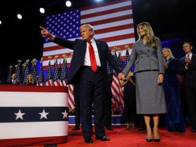 Republican presidential nominee former U.S. President Donald Trump gestures next to his wife Melania Trump, following early results from the 2024 U.S. presidential election in Palm Beach County Convention Center, in West Palm Beach, Florida, U.S., November 6, 2024.  REUTERS/Brian Snyder