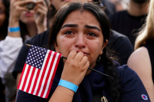 A supporter reacts during Democratic presidential nominee U.S. Vice President Kamala Harris' remarks, conceding the 2024 U.S. presidential election to President-elect Donald Trump, at Howard University in Washington, U.S., November 6, 2024. REUTERS/Kevin Lamarque     TPX IMAGES OF THE DAY