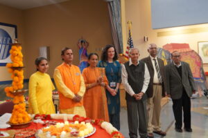 Pic #2 – Chinmaya Mission of NY Brahmcharini Shubhani Chaitanya, AsaM’ai Mandir Acharya Madan Sharma, Cultural Unit Committee Member (CUCM) Mrs. Rekha Tolat, Parker AVP Business Development Rachel Dalton, CUCMs- Mr. Dilip Tolat, Dr. Hiralal Patel, Mr. Harshad Shah.